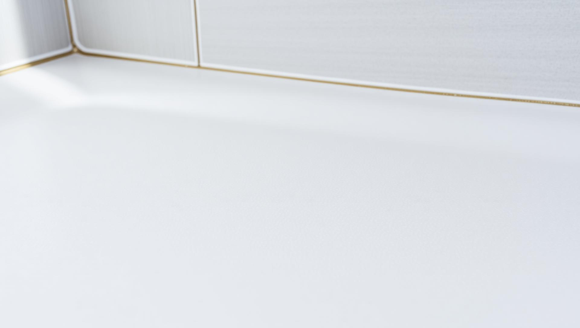 Freshly applied non-slip textured coating on a white shower tray — anti-slip safety coatings